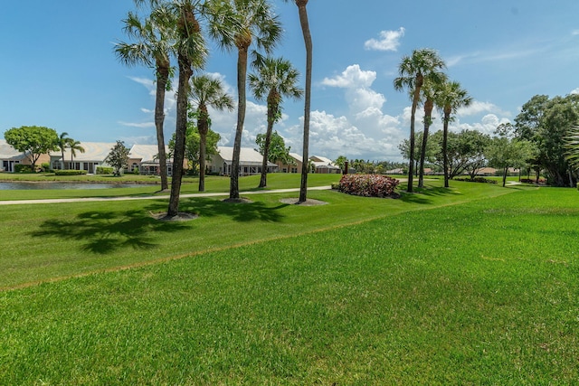 8057 Cassia Dr, Boynton Beach, FL 33472 - surrounding community with a residential view, a lawn, and a water view