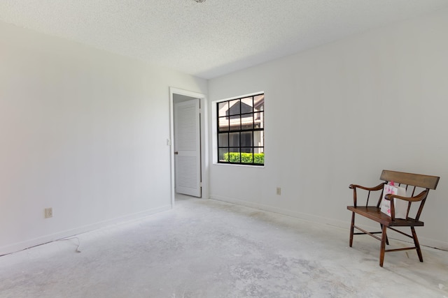 8057 Cassia Dr, Boynton Beach, FL 33472 - unfurnished room featuring a textured ceiling and unfinished concrete floors