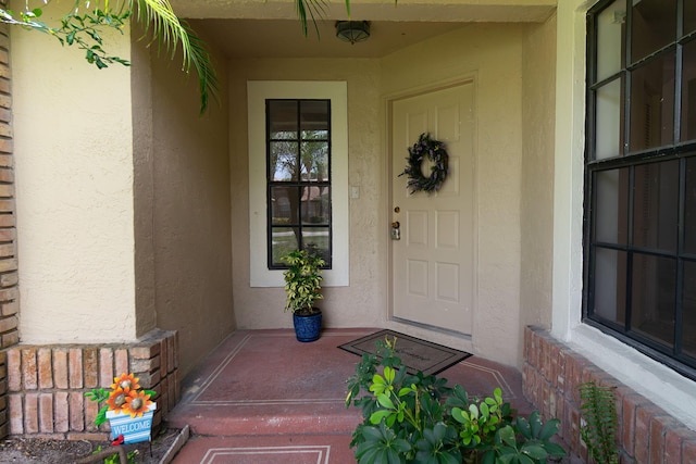 8057 Cassia Dr, Boynton Beach, FL 33472 - entrance to property with stucco siding and a porch