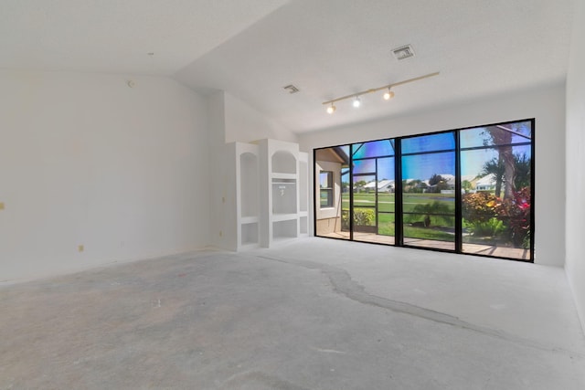 8057 Cassia Dr, Boynton Beach, FL 33472 - empty room with vaulted ceiling and concrete flooring