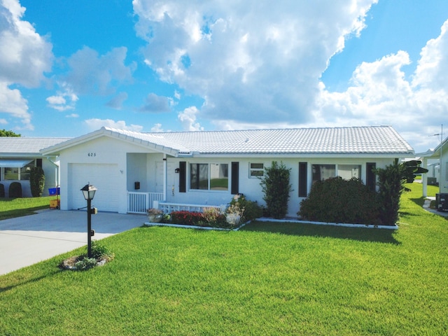 625 SW 21st Cir, Boynton Beach, FL 33426 - single story home featuring a tiled roof, concrete driveway, a front lawn, and a garage