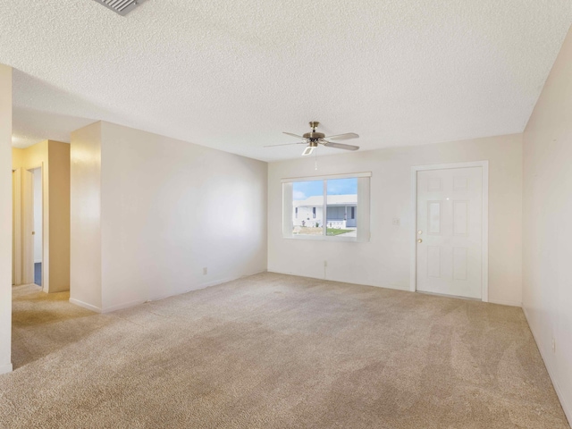 625 SW 21st Cir, Boynton Beach, FL 33426 - unfurnished room with a ceiling fan, light carpet, and a textured ceiling