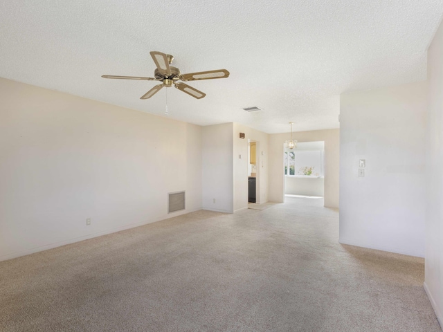 625 SW 21st Cir, Boynton Beach, FL 33426 - empty room featuring light colored carpet, a ceiling fan, and a textured ceiling