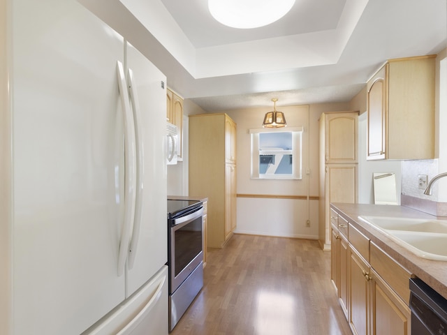625 SW 21st Cir, Boynton Beach, FL 33426 - kitchen featuring white appliances, light brown cabinets, and light wood finished floors