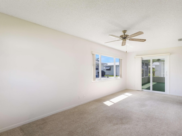 625 SW 21st Cir, Boynton Beach, FL 33426 - spare room featuring ceiling fan, carpet floors, and a textured ceiling