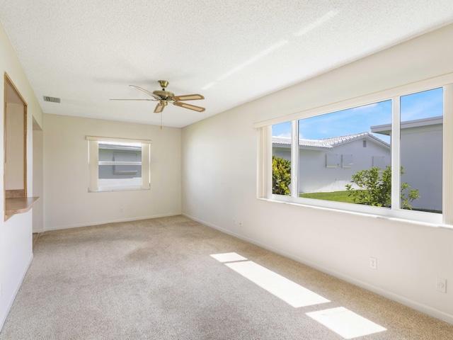 625 SW 21st Cir, Boynton Beach, FL 33426 - empty room with carpet floors, a ceiling fan, and a textured ceiling