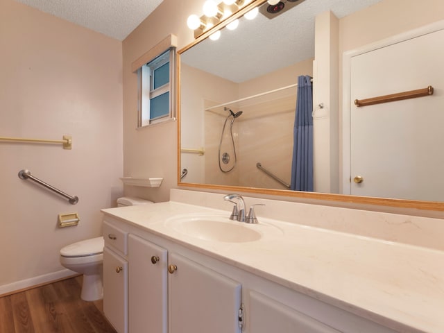 625 SW 21st Cir, Boynton Beach, FL 33426 - bathroom featuring wood finished floors, a textured ceiling, vanity, and curtained shower