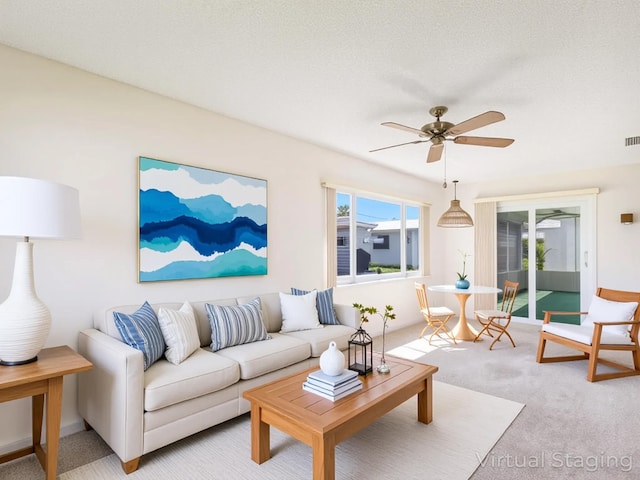 625 SW 21st Cir, Boynton Beach, FL 33426 - living area featuring a ceiling fan and light carpet