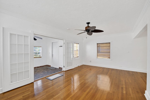 511 S K St, Lake Worth Beach, FL 33460 - spare room featuring ceiling fan, wood-type flooring, healthy amount of natural light, and crown molding