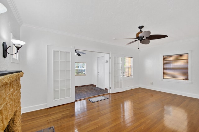 511 S K St, Lake Worth Beach, FL 33460 - unfurnished living room featuring a ceiling fan, wood finished floors, and crown molding