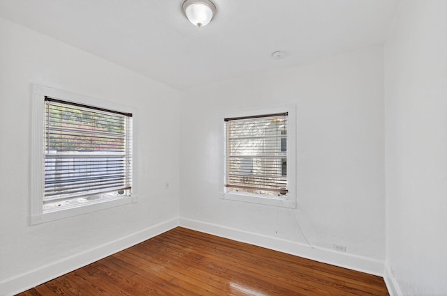511 S K St, Lake Worth Beach, FL 33460 - spare room featuring wood finished floors and a smoke detector