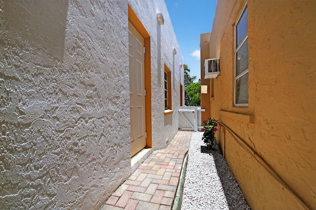 511 S K St, Lake Worth Beach, FL 33460 - view of side of property with a gate and stucco siding