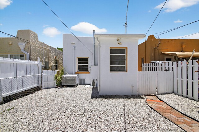 511 S K St, Lake Worth Beach, FL 33460 - view of home's exterior featuring stucco siding, a fenced backyard, and a gate