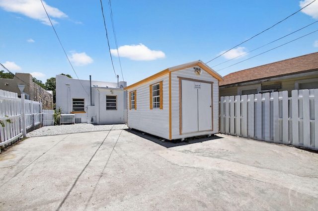 511 S K St, Lake Worth Beach, FL 33460 - back of property featuring a patio and a shed
