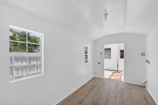 511 S K St, Lake Worth Beach, FL 33460 - unfurnished room featuring wood finished floors and vaulted ceiling