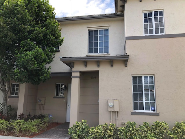 1991 Marsh Harbor Dr, Riviera Beach, FL 33404 - view of property exterior featuring stucco siding