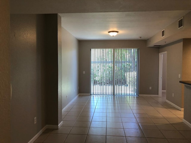 1991 Marsh Harbor Dr, Riviera Beach, FL 33404 - unfurnished room featuring light tile patterned floors and baseboards