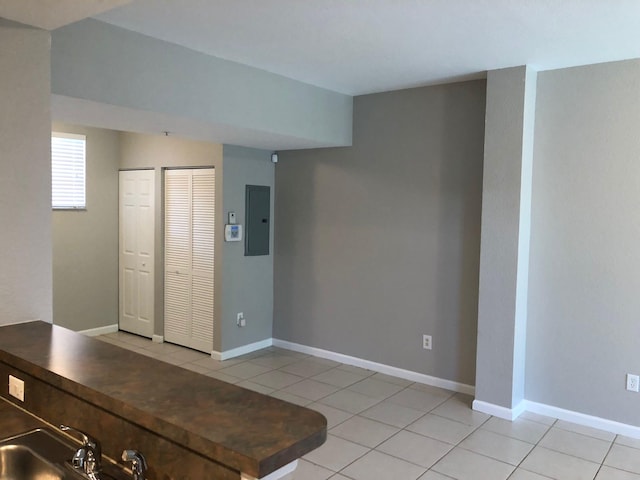 1991 Marsh Harbor Dr, Riviera Beach, FL 33404 - interior space with electric panel and light tile patterned floors