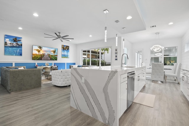 13313 Machiavelli Way, Palm Beach Gardens, FL 33418 - kitchen featuring modern cabinets, white cabinets, recessed lighting, stainless steel dishwasher, and light wood-style flooring