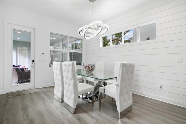 13313 Machiavelli Way, Palm Beach Gardens, FL 33418 - dining area with wood finished floors and a chandelier