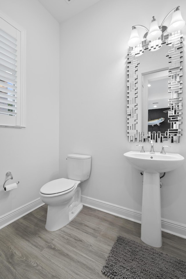 13313 Machiavelli Way, Palm Beach Gardens, FL 33418 - bathroom featuring toilet and wood finished floors