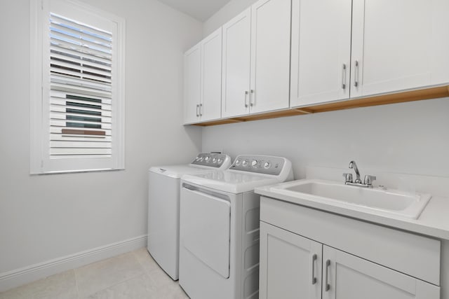 13313 Machiavelli Way, Palm Beach Gardens, FL 33418 - laundry room featuring washing machine and clothes dryer, cabinet space, and light tile patterned floors