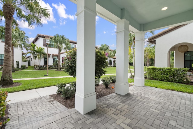 13313 Machiavelli Way, Palm Beach Gardens, FL 33418 - covered porch featuring a lawn