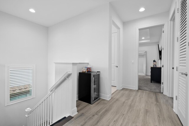 13313 Machiavelli Way, Palm Beach Gardens, FL 33418 - hallway with an upstairs landing, light wood-style floors, and recessed lighting