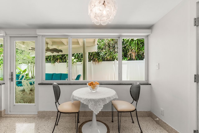 301 Linda Ln, West Palm Beach, FL 33405 - dining space featuring speckle patterned floor and a chandelier