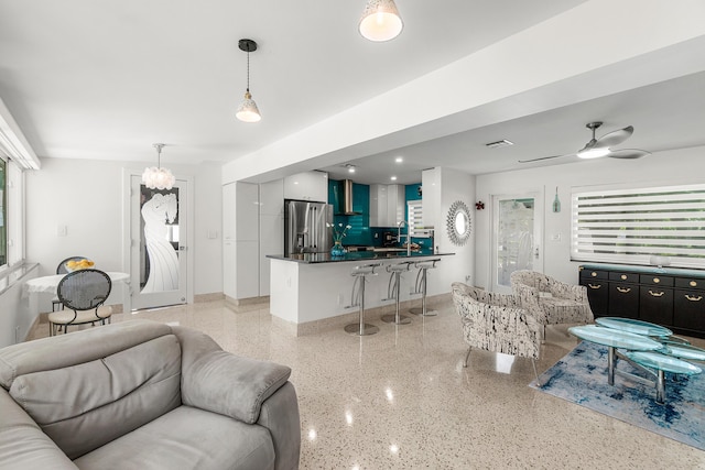 301 Linda Ln, West Palm Beach, FL 33405 - living room with dark speckled floor and ceiling fan