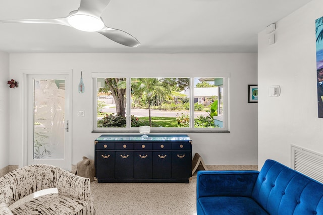 301 Linda Ln, West Palm Beach, FL 33405 - living area featuring dark aggregate flooring and ceiling fan