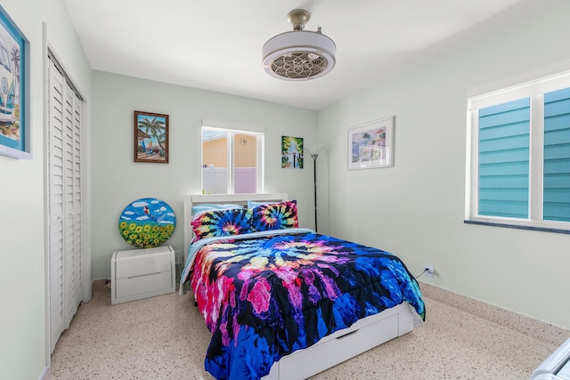 301 Linda Ln, West Palm Beach, FL 33405 - bedroom featuring speckle patterned floor, a closet, and ceiling fan