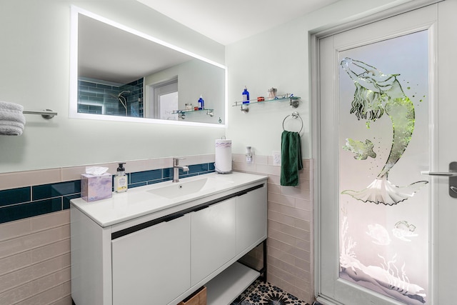 301 Linda Ln, West Palm Beach, FL 33405 - bathroom with tile walls, vanity, and wainscoting
