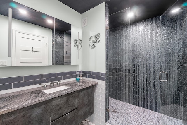 301 Linda Ln, West Palm Beach, FL 33405 - bathroom with a stall shower, vanity, and tile walls