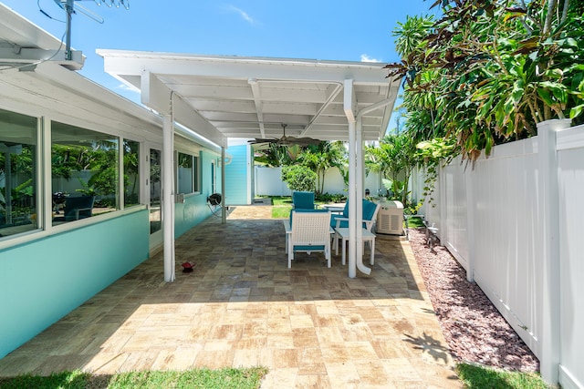 301 Linda Ln, West Palm Beach, FL 33405 - fenced backyard with a patio area and outdoor dining area