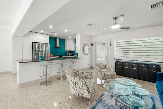 301 Linda Ln, West Palm Beach, FL 33405 - living area featuring dark speckled floor, ceiling fan, and recessed lighting