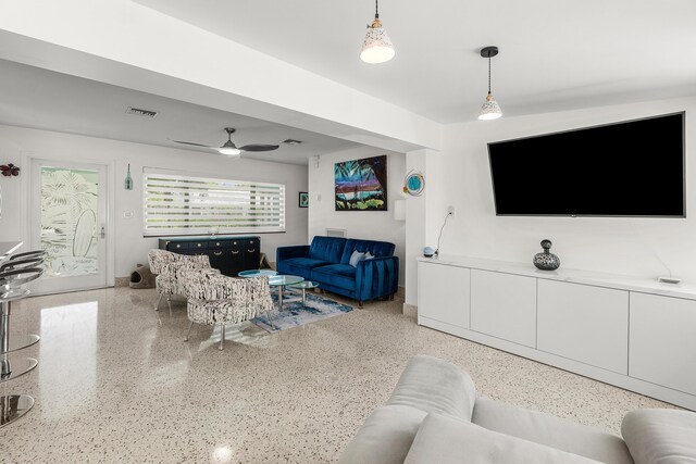 301 Linda Ln, West Palm Beach, FL 33405 - living area featuring speckled floor and a ceiling fan