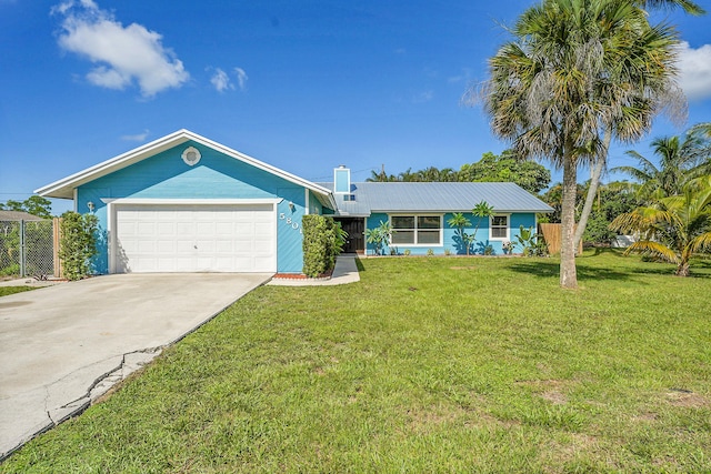 5801 SE Cable Dr, Stuart, FL 34997 - ranch-style home with a garage, driveway, and a metal roof