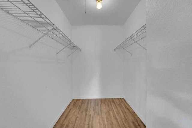 5801 SE Cable Dr, Stuart, FL 34997 - spacious closet featuring wood finished floors