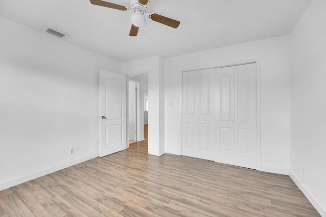 5801 SE Cable Dr, Stuart, FL 34997 - unfurnished bedroom featuring light wood-style flooring, a closet, and a ceiling fan