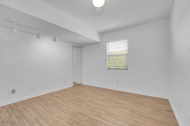 5801 SE Cable Dr, Stuart, FL 34997 - unfurnished room with track lighting and light wood-style floors