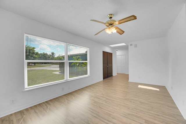5801 SE Cable Dr, Stuart, FL 34997 - spare room with ceiling fan and light wood-style flooring