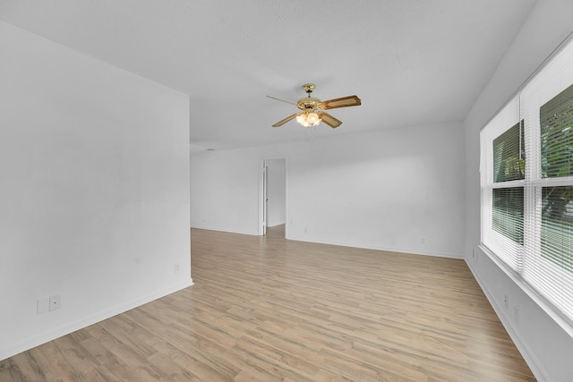 5801 SE Cable Dr, Stuart, FL 34997 - empty room featuring ceiling fan and light wood-style floors
