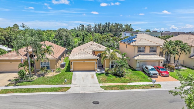 7727 Colony Lake Dr, Boynton Beach, FL 33436 - mediterranean / spanish-style home featuring stucco siding, a tile roof, a front yard, and concrete driveway