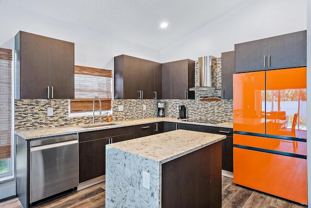 7727 Colony Lake Dr, Boynton Beach, FL 33436 - kitchen with stainless steel dishwasher, wall chimney range hood, vaulted ceiling, plenty of natural light, and dark wood-style flooring