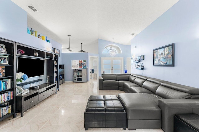7782 Stirling Bridge Blvd S, Delray Beach, FL 33446 - living room with a chandelier, ceiling fan, and high vaulted ceiling