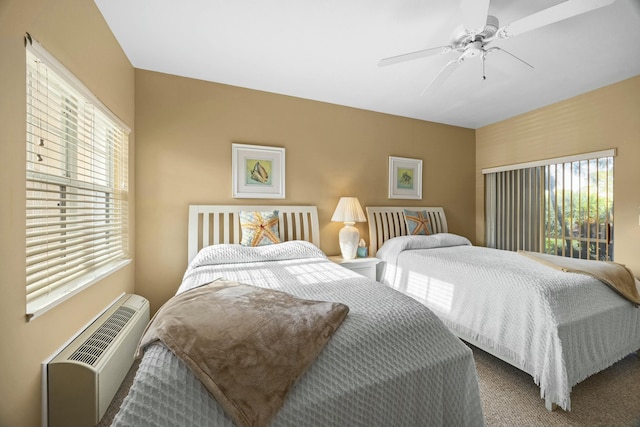 9894 Perfect Dr Unit 21, Port Saint Lucie, FL 34986 - carpeted bedroom with a ceiling fan and an AC wall unit
