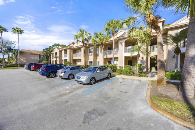 9894 Perfect Dr Unit 21, Port Saint Lucie, FL 34986 - view of building exterior with uncovered parking