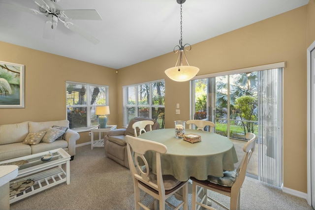 9894 Perfect Dr Unit 21, Port Saint Lucie, FL 34986 - dining room featuring light colored carpet and a ceiling fan