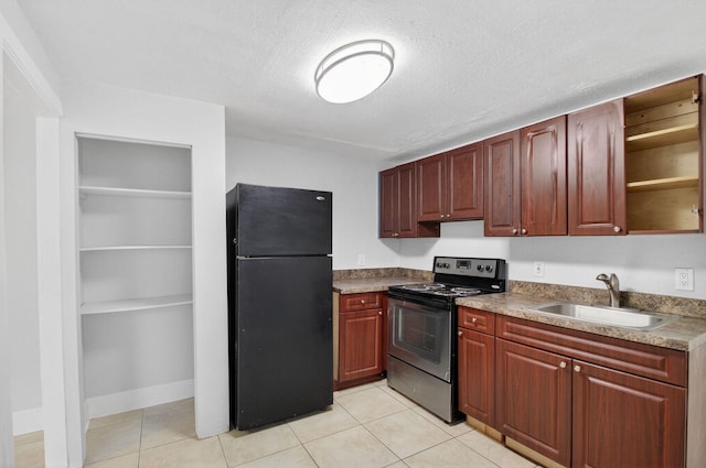 323 S E St, Lake Worth Beach, FL 33460 - kitchen featuring freestanding refrigerator, range with electric stovetop, open shelves, a textured ceiling, and light tile patterned floors